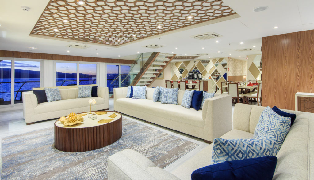 A sophisticated interior lounge onboard the Elite Galapagos Luxury Expedition